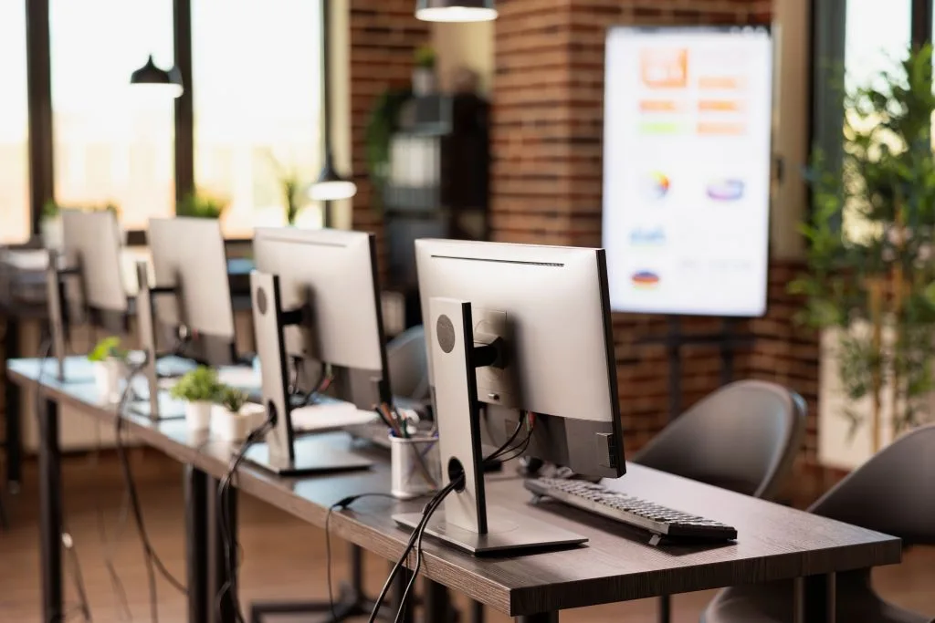 Office desks with desktop computers – where to safely dispose of old electronics in Vilnius